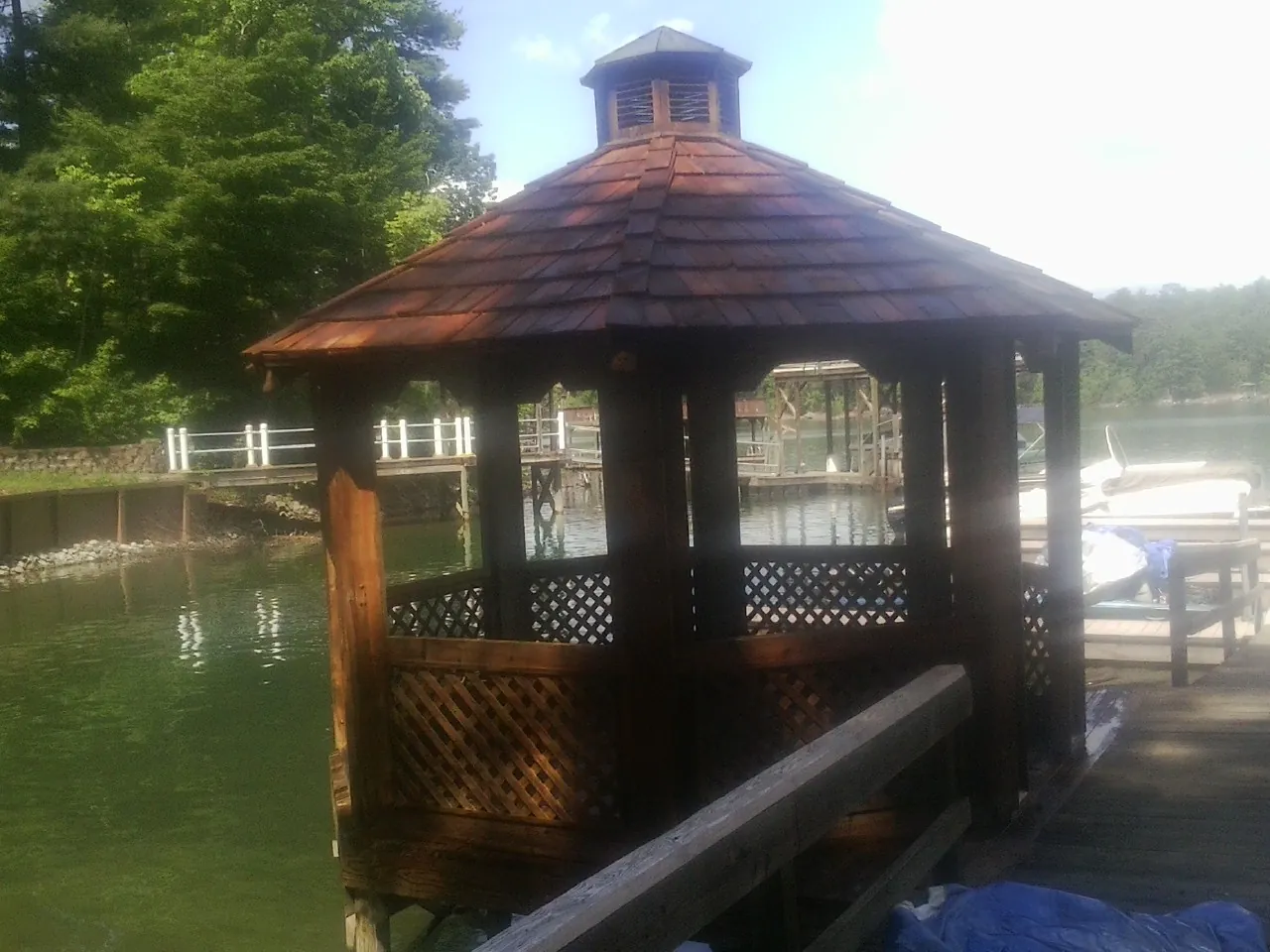 Cedar shake gazebo roof rebuilt on a lake dock in Lake City